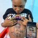 Pregnant Lady Does A Tattoo Of Mayorkun On Her Stomach