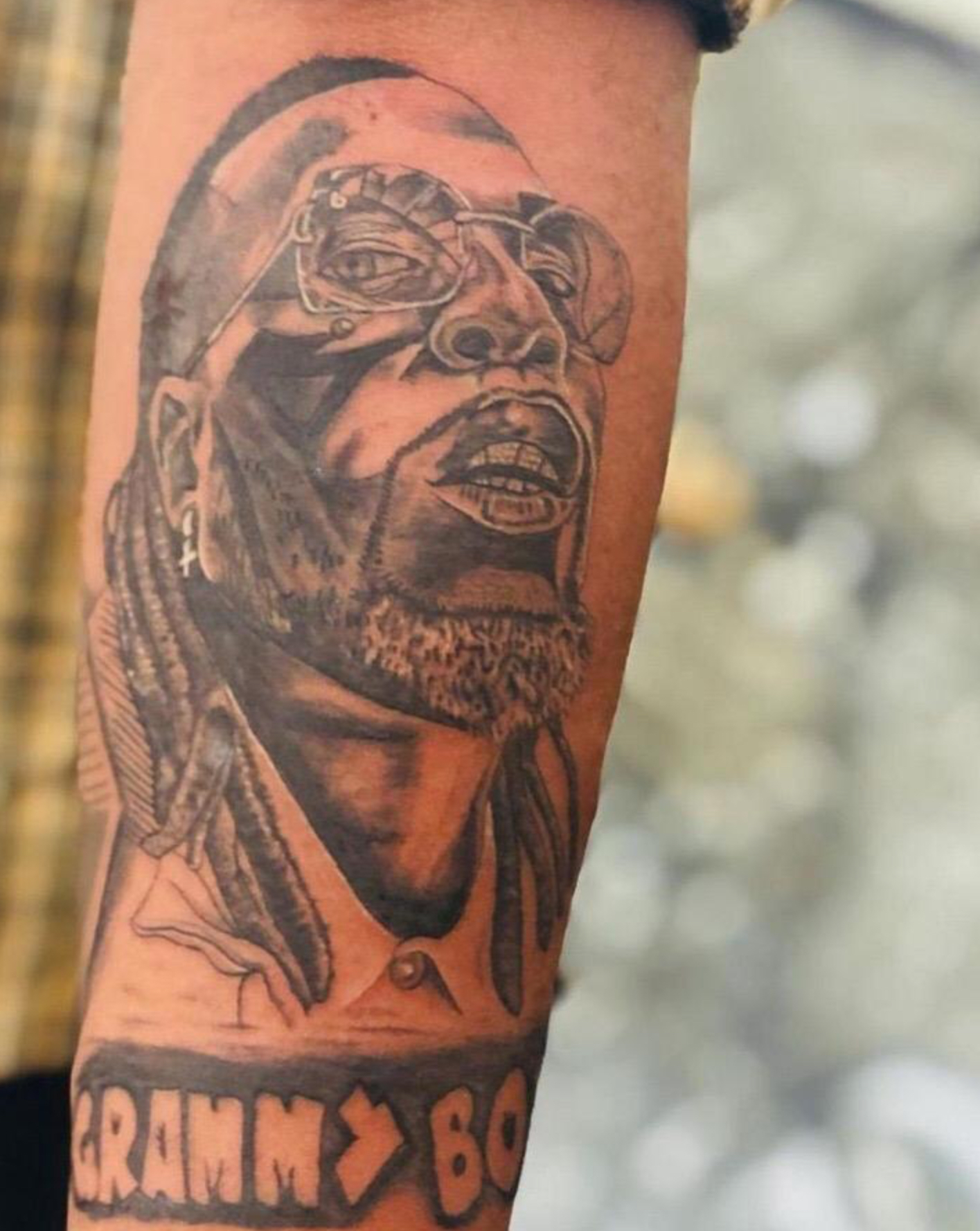 “Grammy Boy” – Fan Draws Tattoo Of Burna Boy In Honor Of Grammy Win