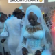 Lady stops groom from dancing with his bride at their wedding