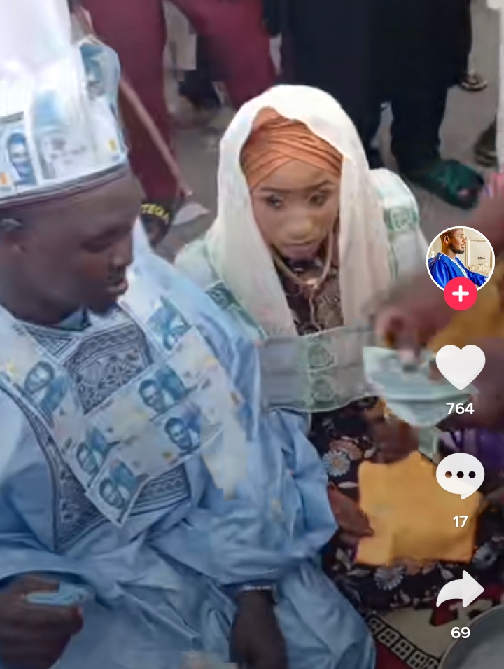 Couple with Naira note necklace wedding