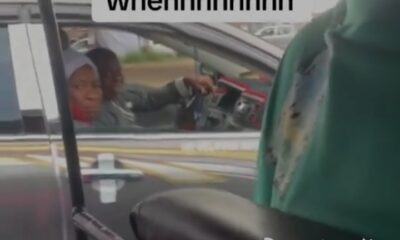 Nigerian man car front sit
