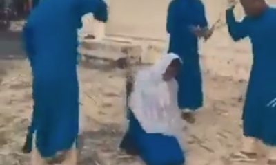 Female student drinking beer flogged