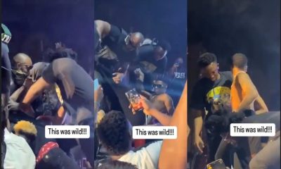 Wizkid dragged on stage by fan