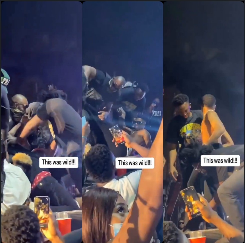 Wizkid dragged on stage by fan