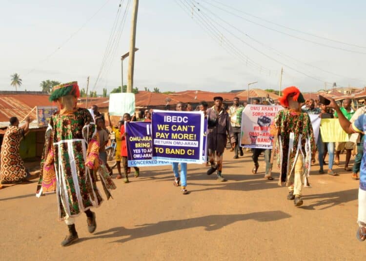 Masquerades Protest High Electricity Bill