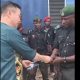Nigerian Police officers Queue Cash